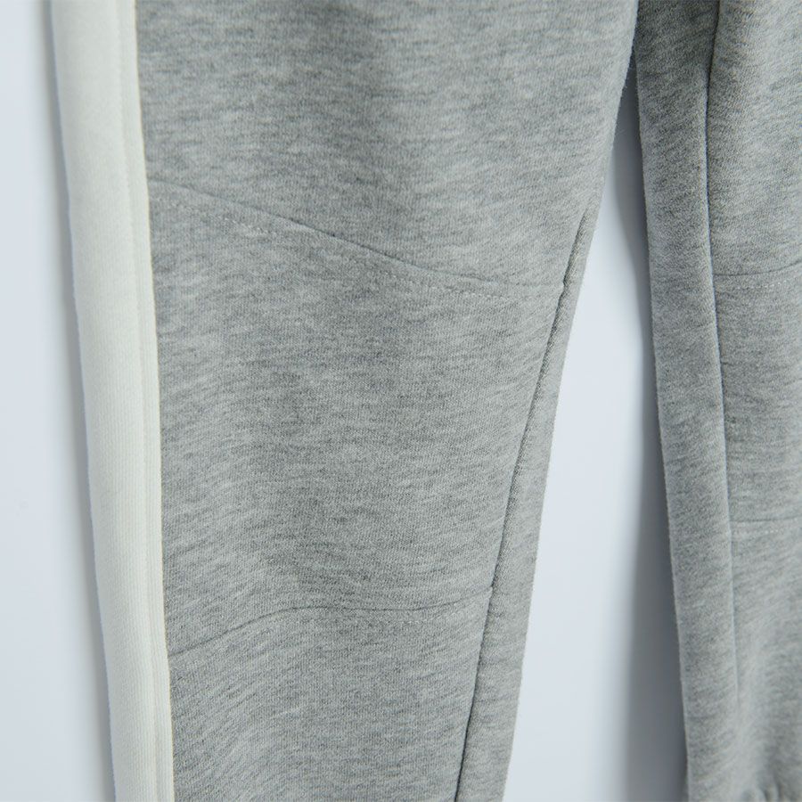 Grey jogging pants with white stripe on the side