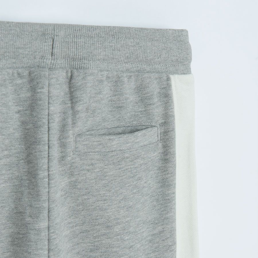 Grey jogging pants with white stripe on the side