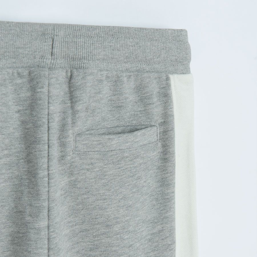 Grey jogging pants with white stripe on the side