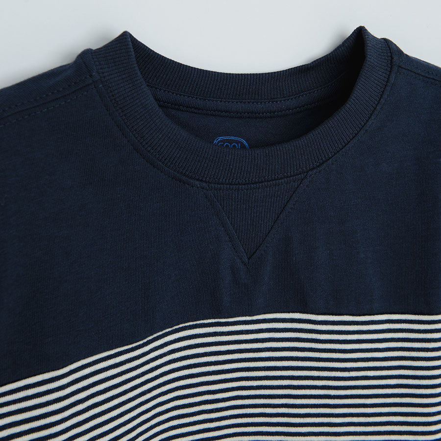 Light blue, white and dark blue striped sweatshirt