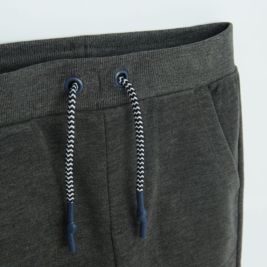 Grey jogging pants with cord on the waist