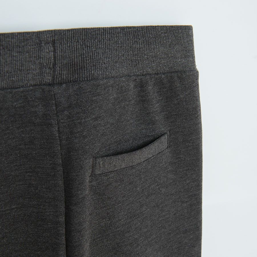 Grey jogging pants with cord on the waist