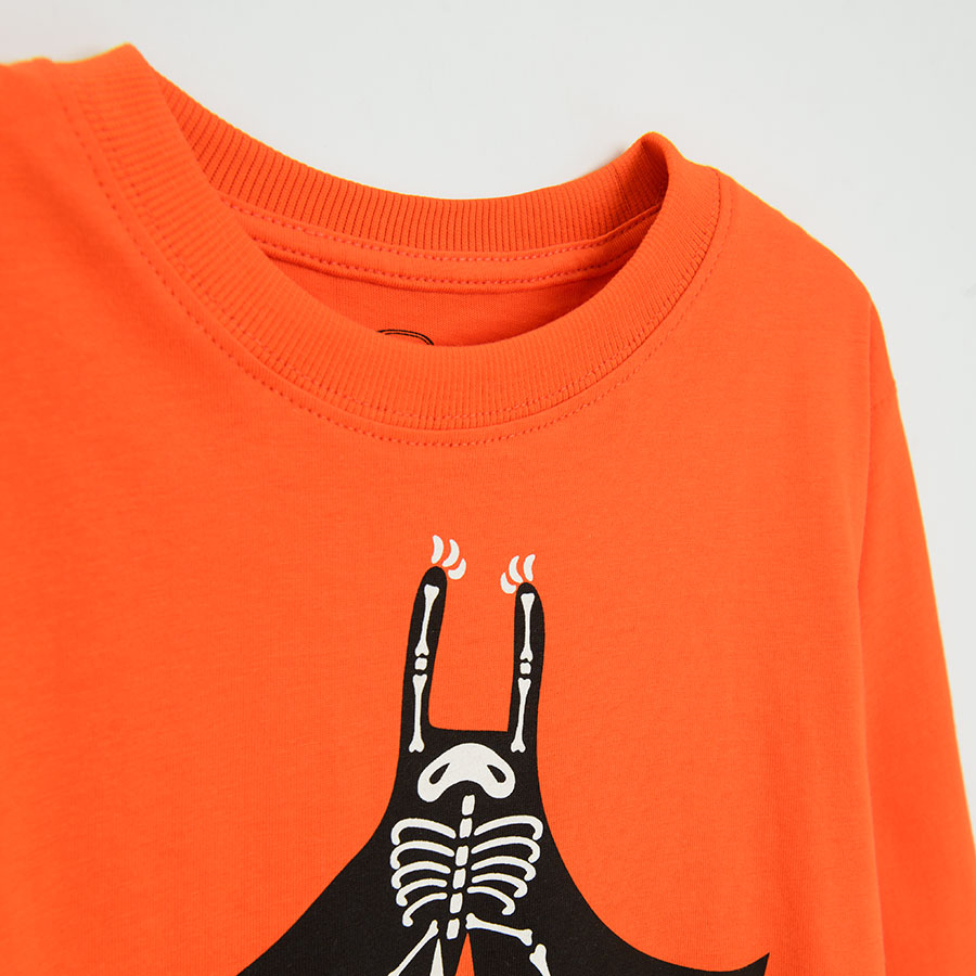 Orange long sleeve blouse with upside down bat print