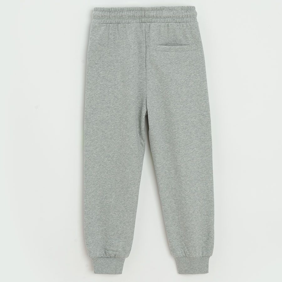 Grey jogging pants with blue and green stripes
