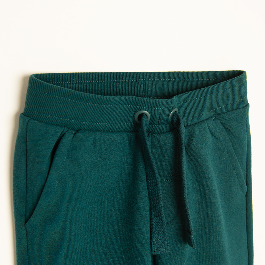 Green jogging pants