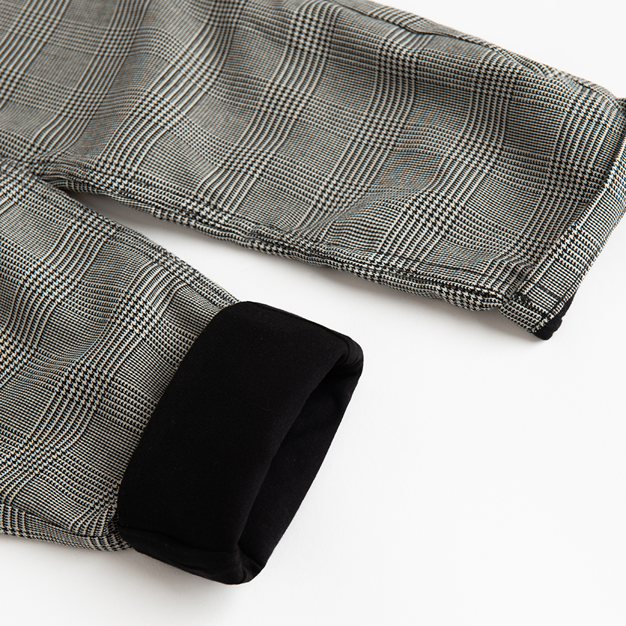 Grey pants with suspenders