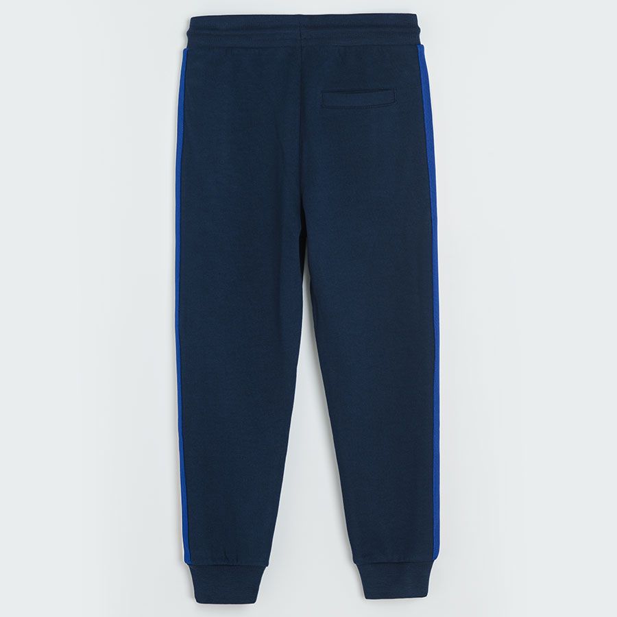 Dark blue jogging pants with yellow, white and blue stripe on the side