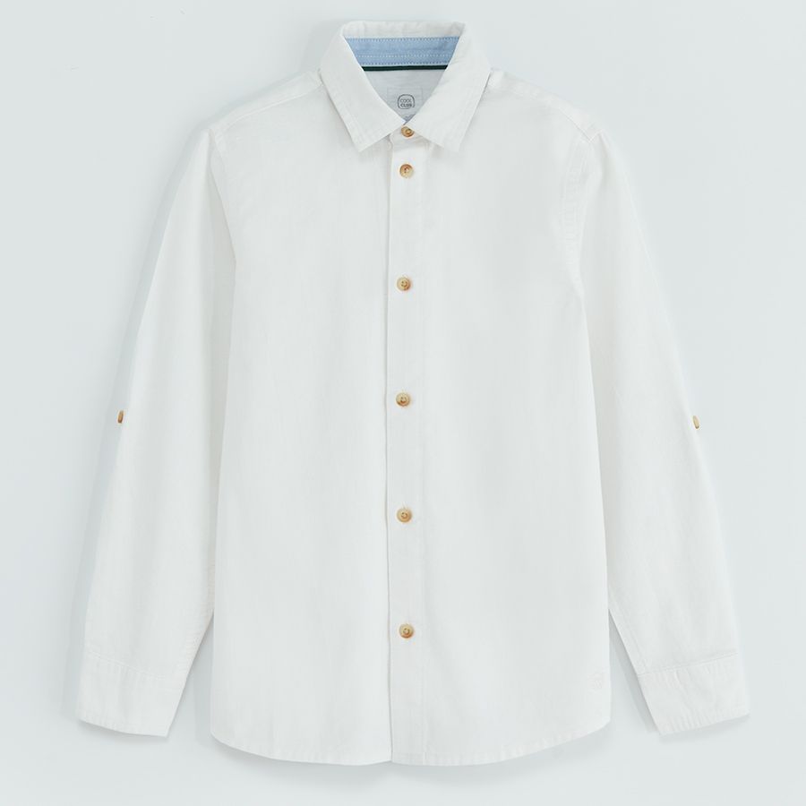 White long sleeve shirt with sleeve rolling up to a button