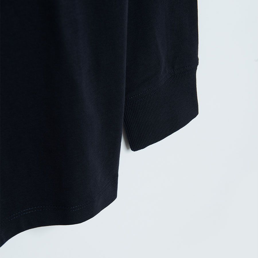 Black long sleeve blouse with 'GENIUS' print