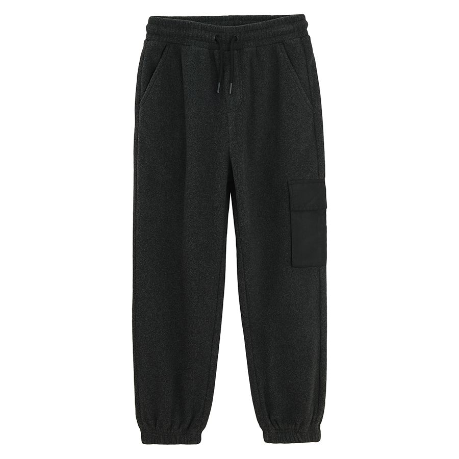 Grey jogging pants with pocket on the left leg