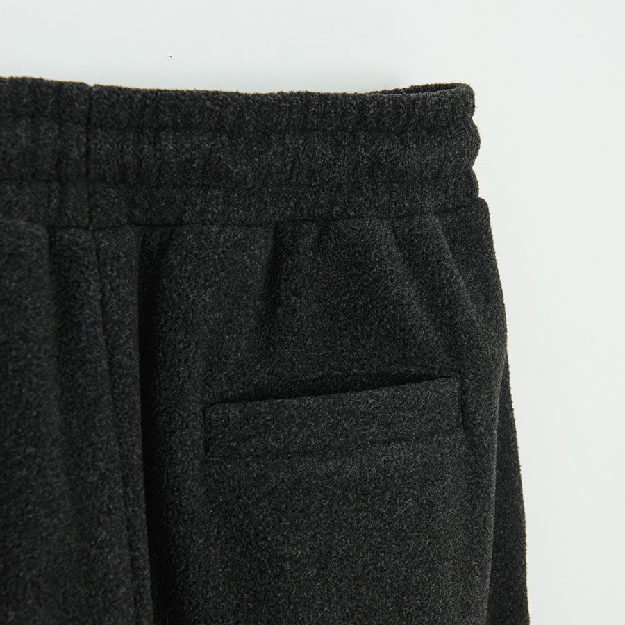 Grey jogging pants with pocket on the left leg