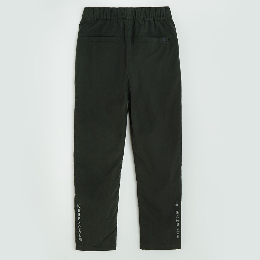 Dark grey trousers with side pockets