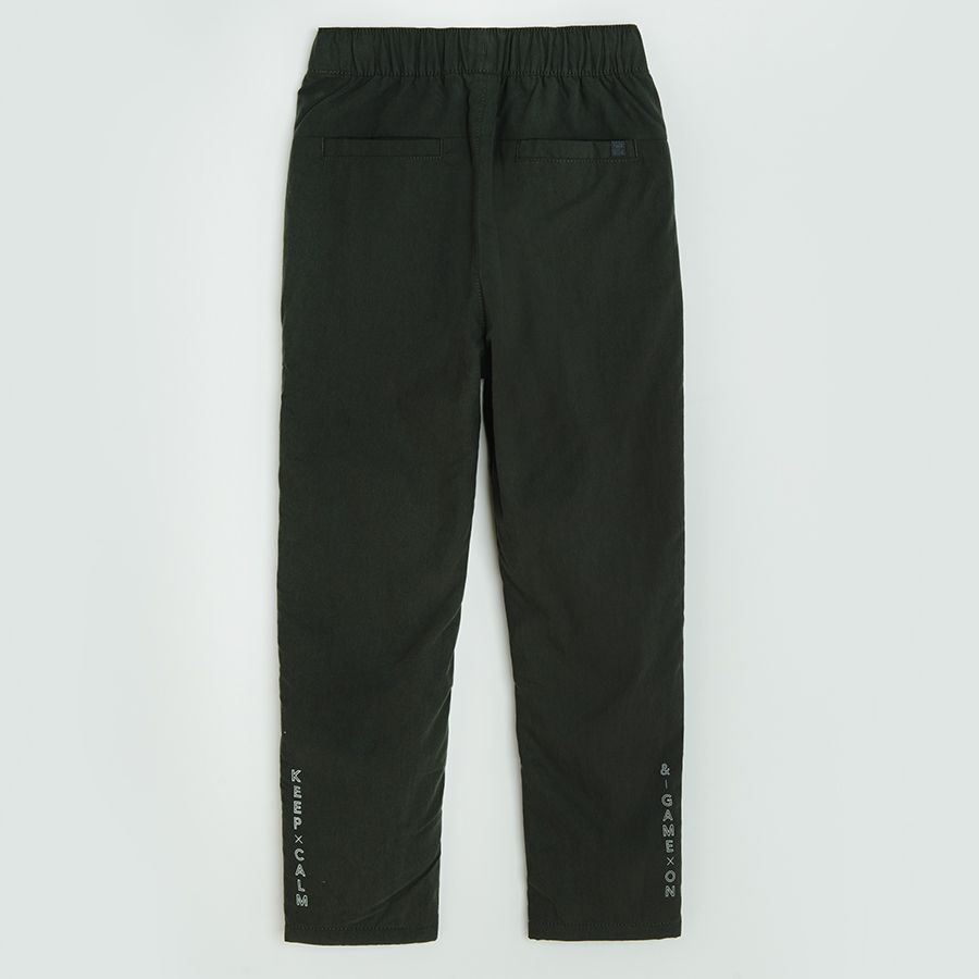 Dark grey trousers with side pockets
