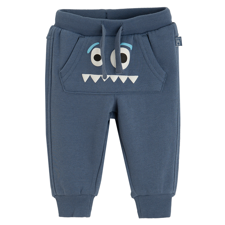 Blue grey jogging pants with funny face print