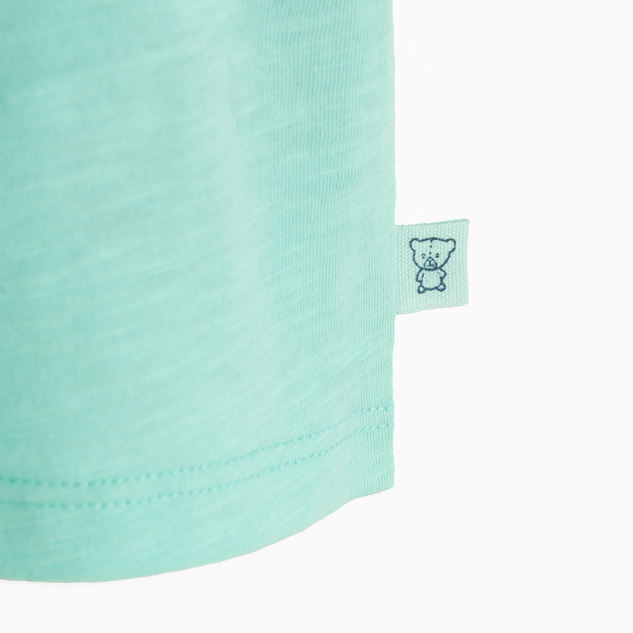 Turquoise polo T-shirt with Bortn to Surf print on the back