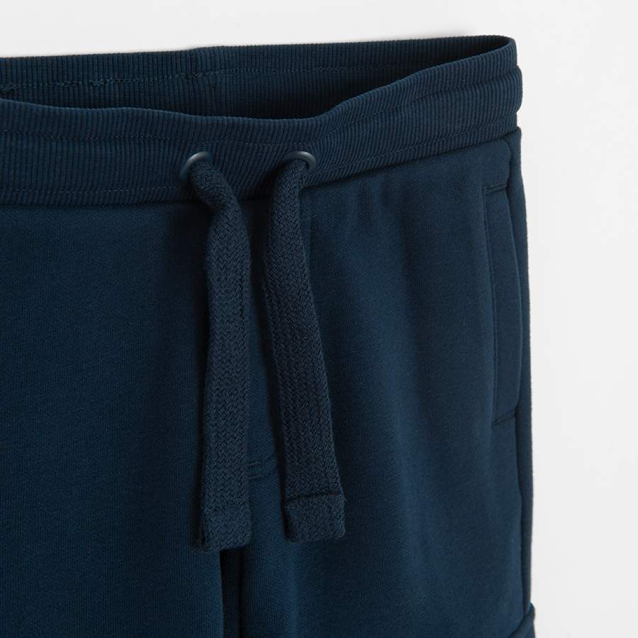 Dark blue cargo style sweatpants with cord