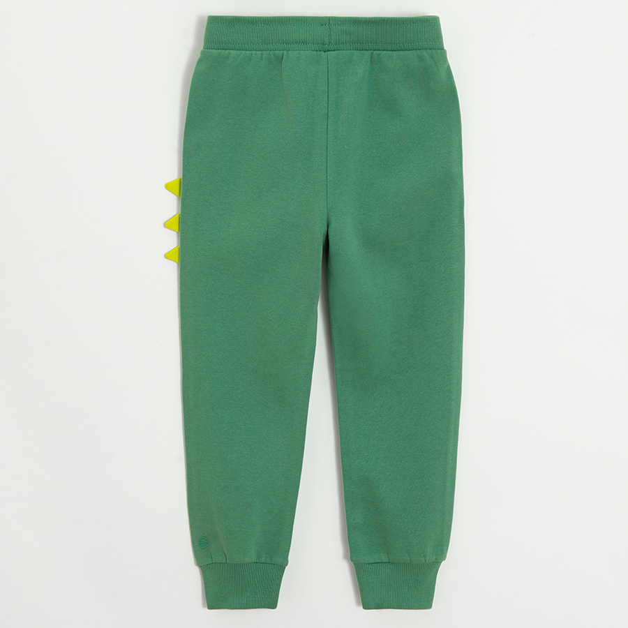 Green sweatpants with dinosaurs style