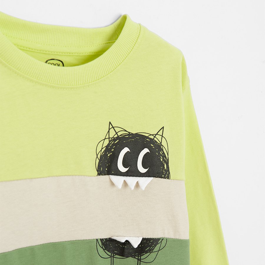 Green sweatshirt with funny creature