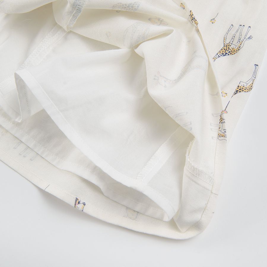 White sleeveless dress with giraffe print