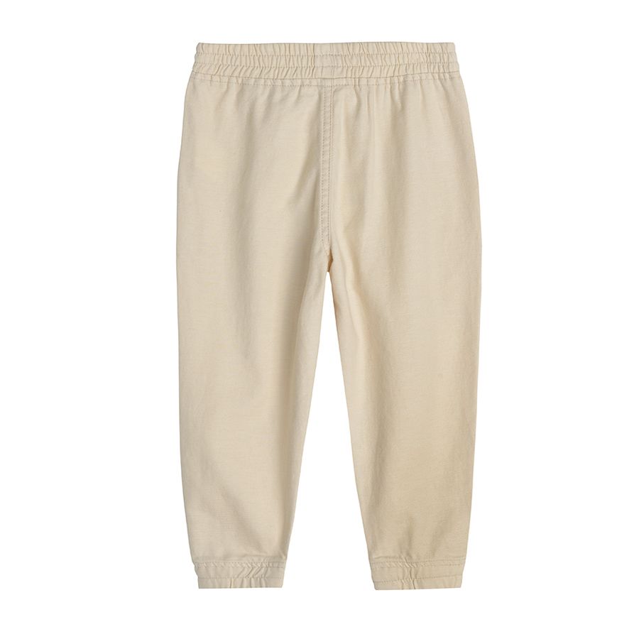 Cream trousers with elastic waist