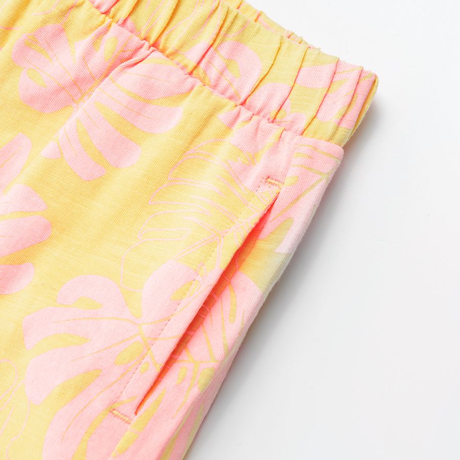Yellow shorts with elastic waist and cord with pink leaves print
