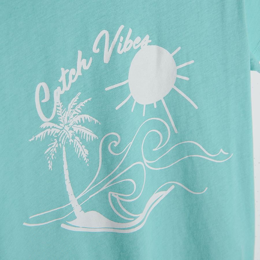 Light blue short sleeve blouse with beach print