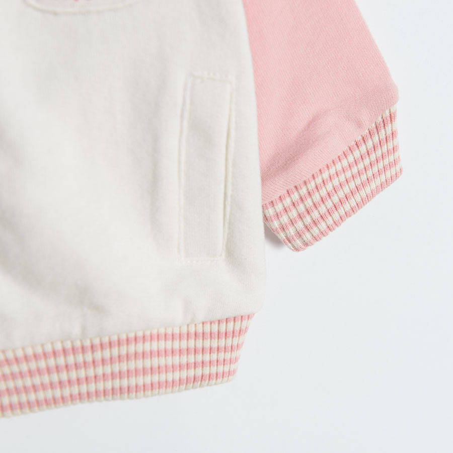 White zip through sweatshirt with pink sleeves