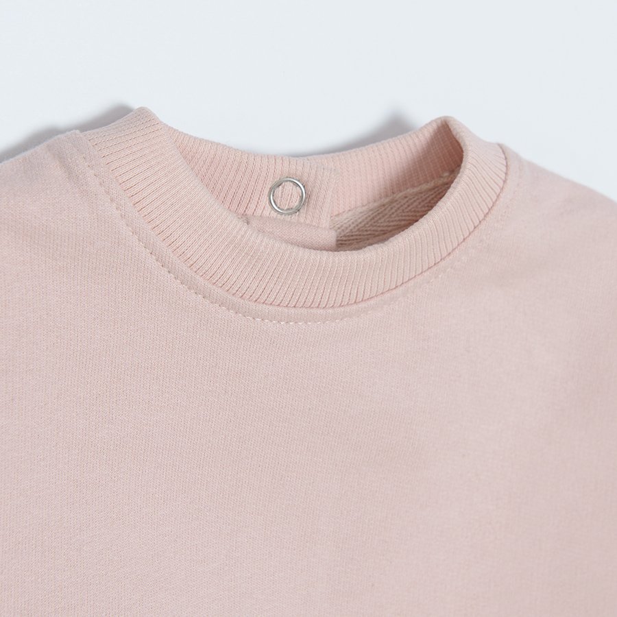 Light pink sweatshirt with embroidered sleeves