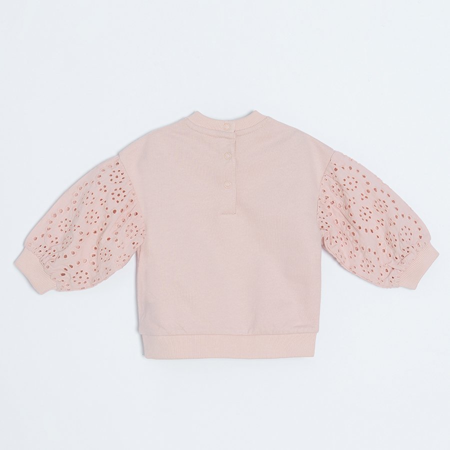 Light pink sweatshirt with embroidered sleeves