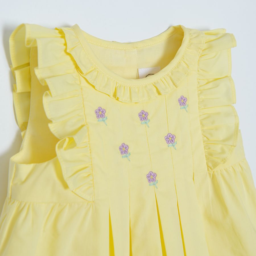 Yellow short sleeve classic dress with ruffles on the sleeves and neckline