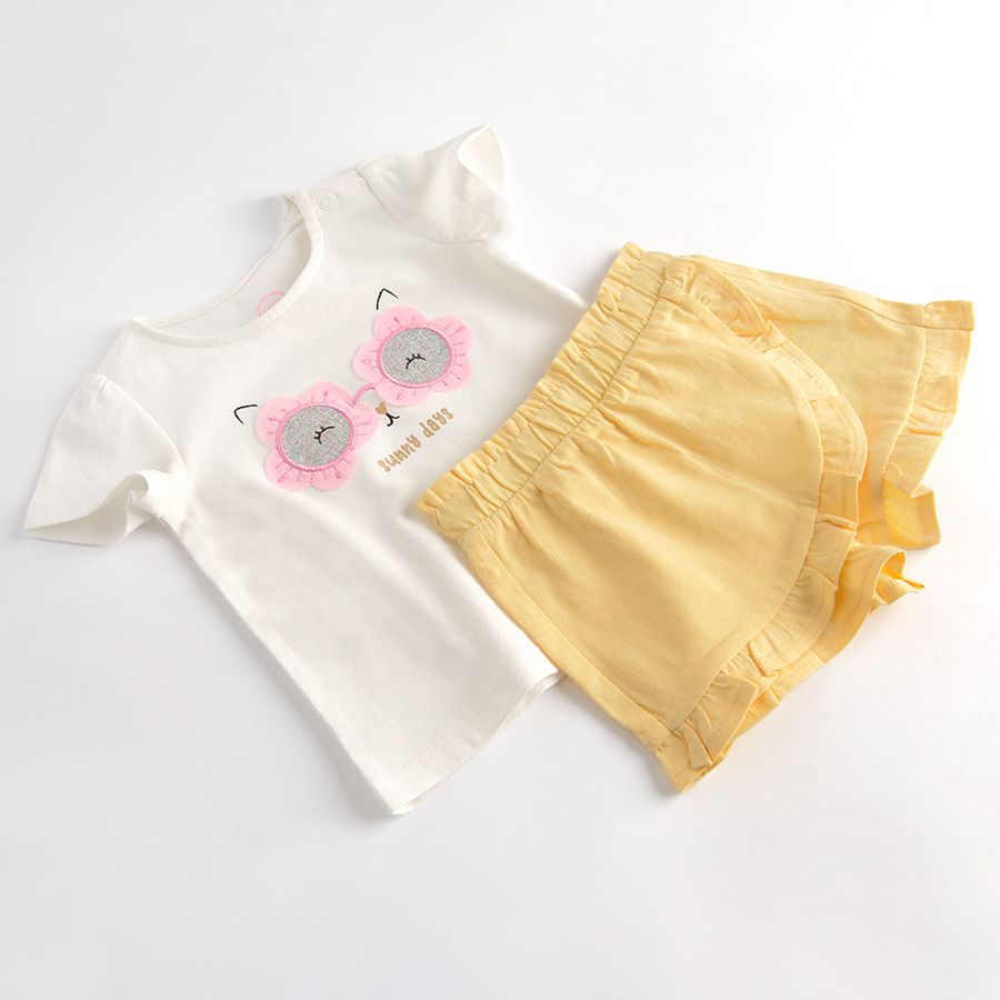 White short sleeve T-shirt with sunglasses print and yellow shorts/skirt set