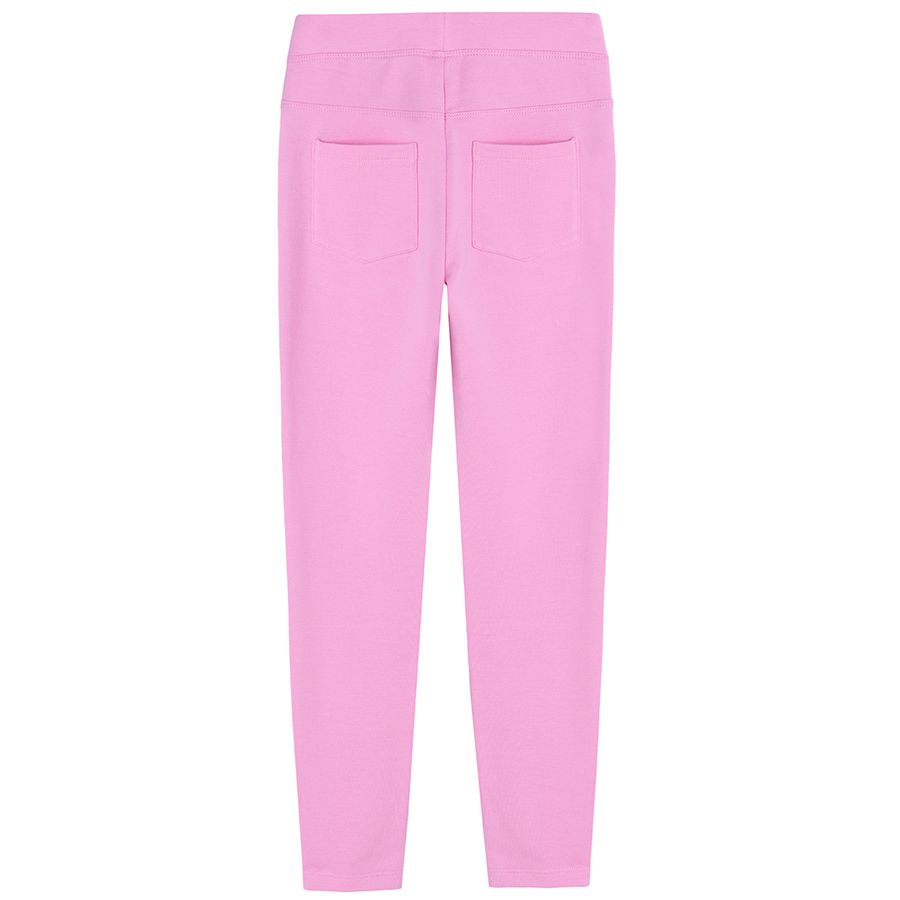 Pink jeggings with cats print on the knees