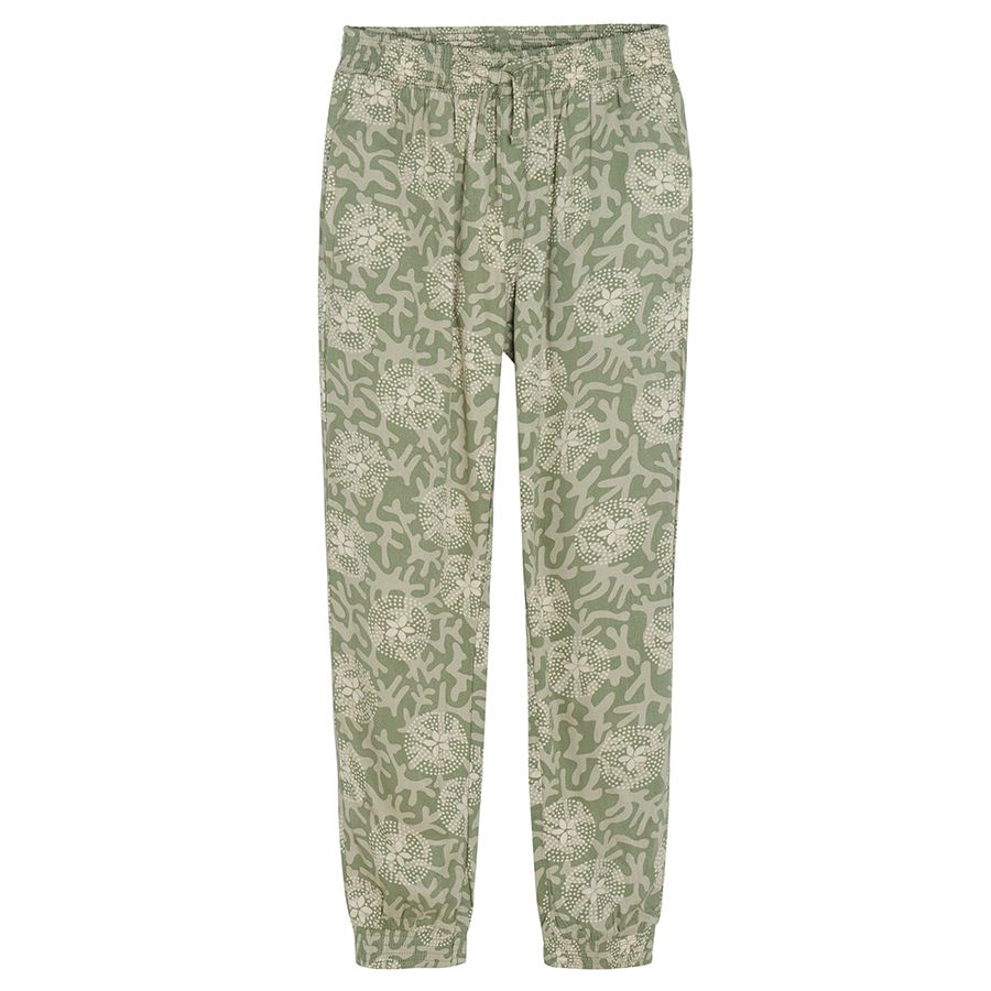 Tuquoise wide trousers with white flower patterns
