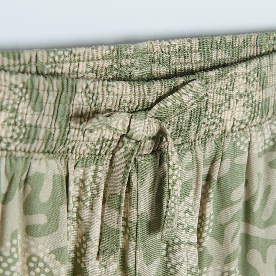 Tuquoise wide trousers with white flower patterns