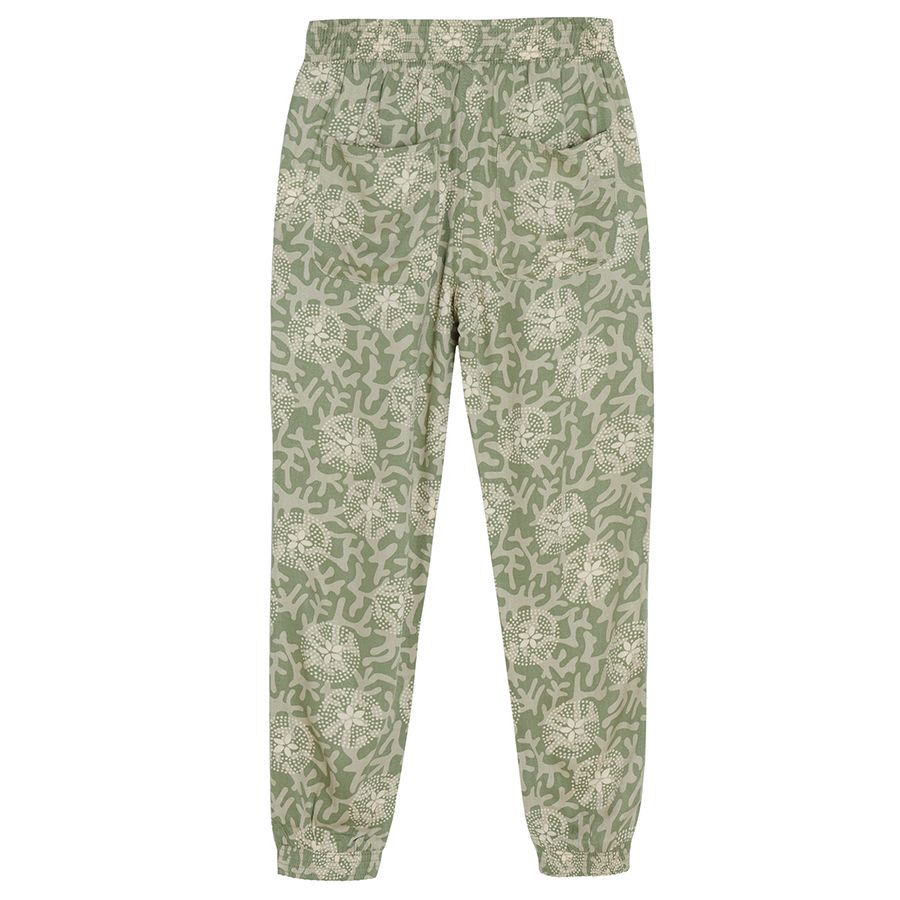 Tuquoise wide trousers with white flower patterns