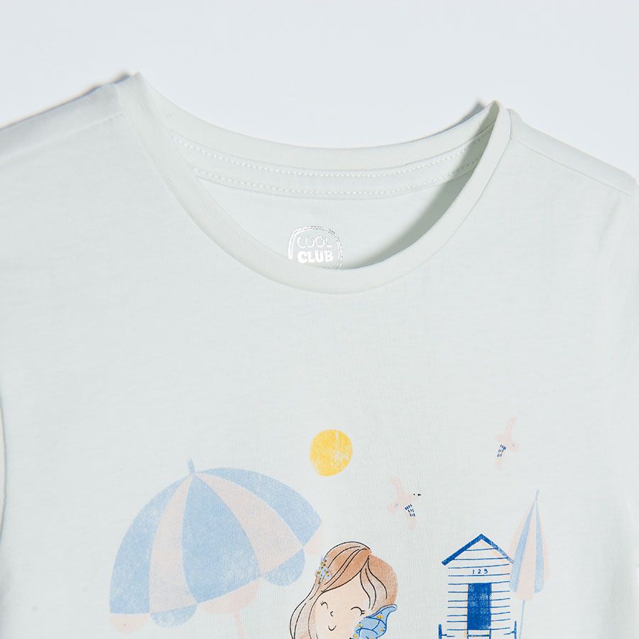White short sleeve T-shirt with girl on the beach print