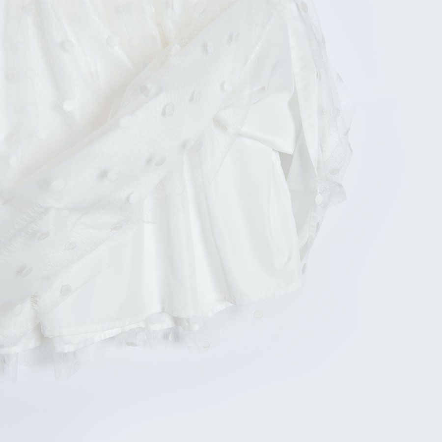 Φόρεμα αμάνικο λευκό πουά με ροζ ζώνη