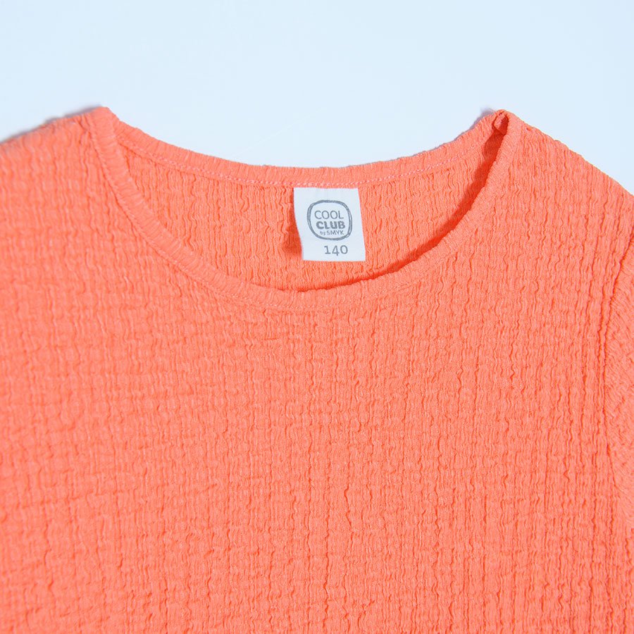 Coral short sleeve T-shirt with elastic cords on the sides