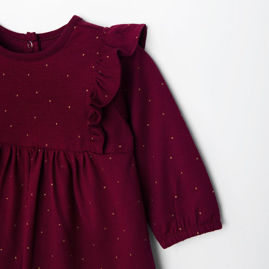 Burgundy polka dot long sleeve dress with ruffles on the shoulders