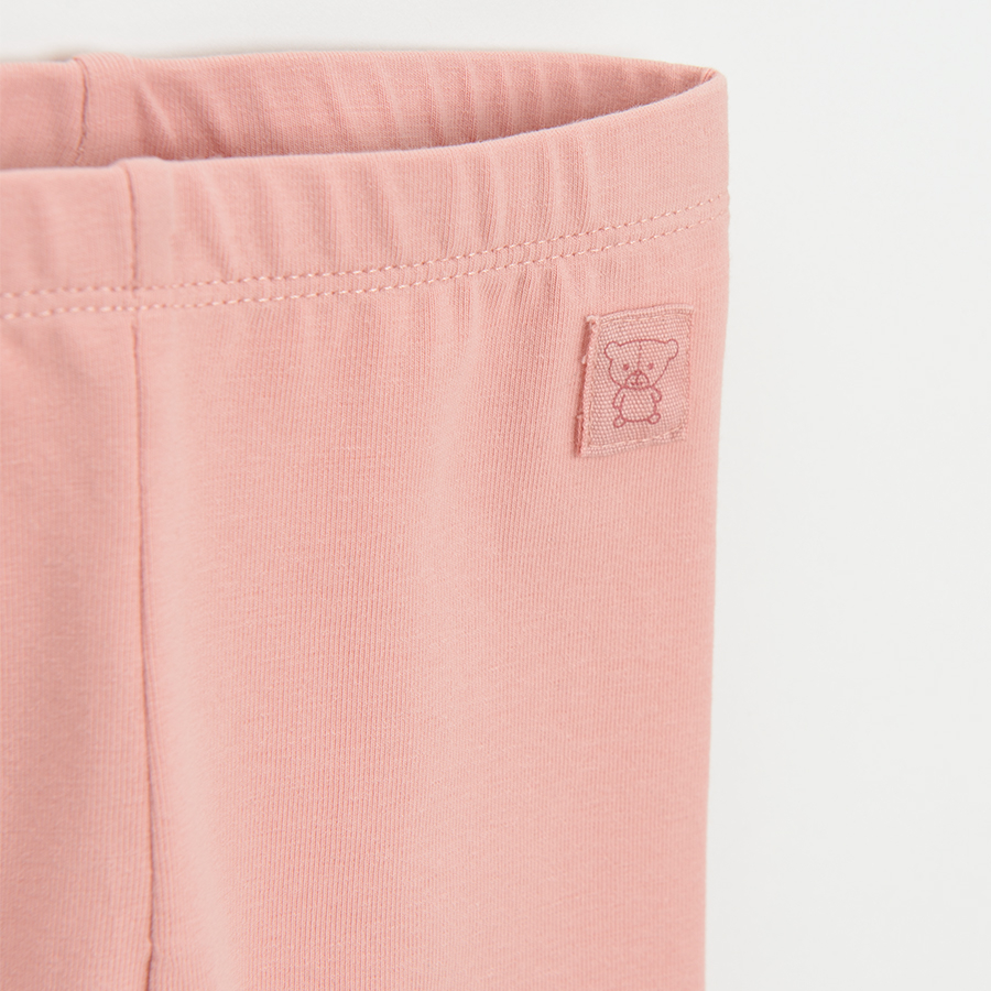 Dusty pink leggings with ruffle at the bottom