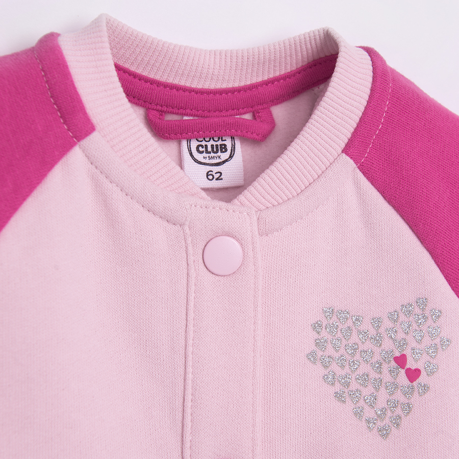 Pink button down sweatshirt with 'Je t'aime' print on the back