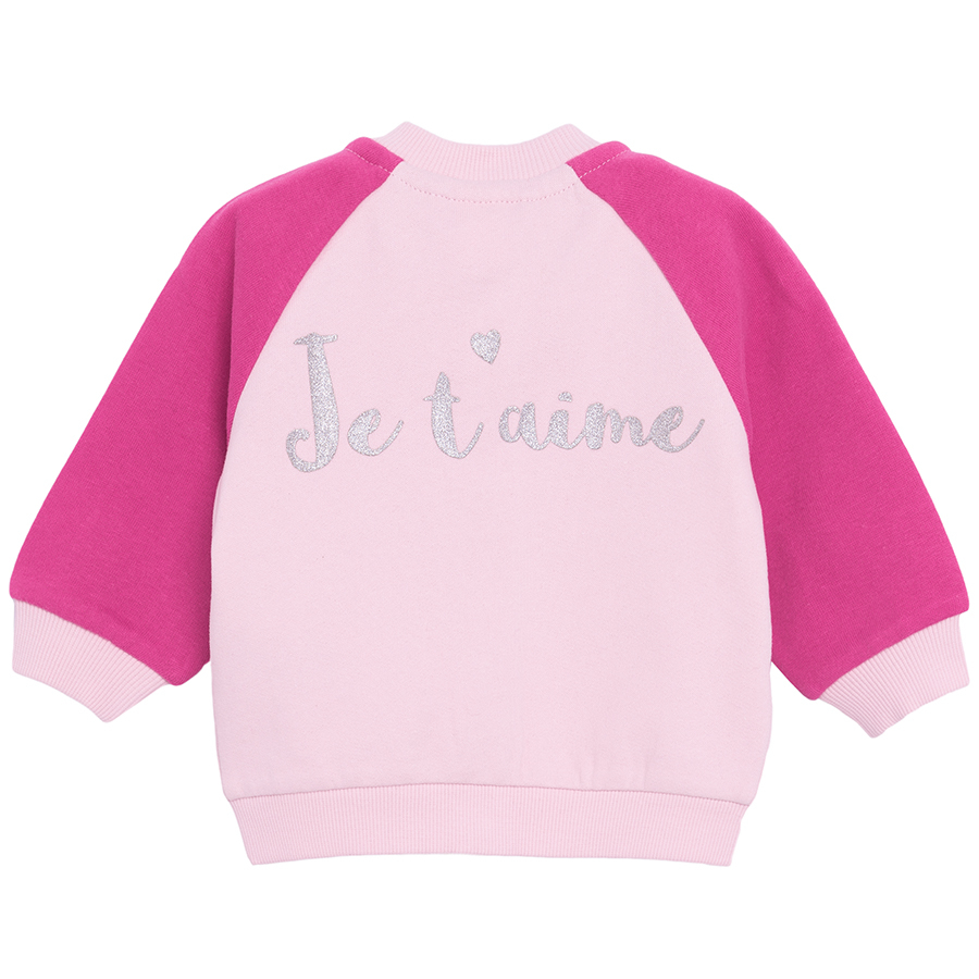 Pink button down sweatshirt with 'Je t'aime' print on the back