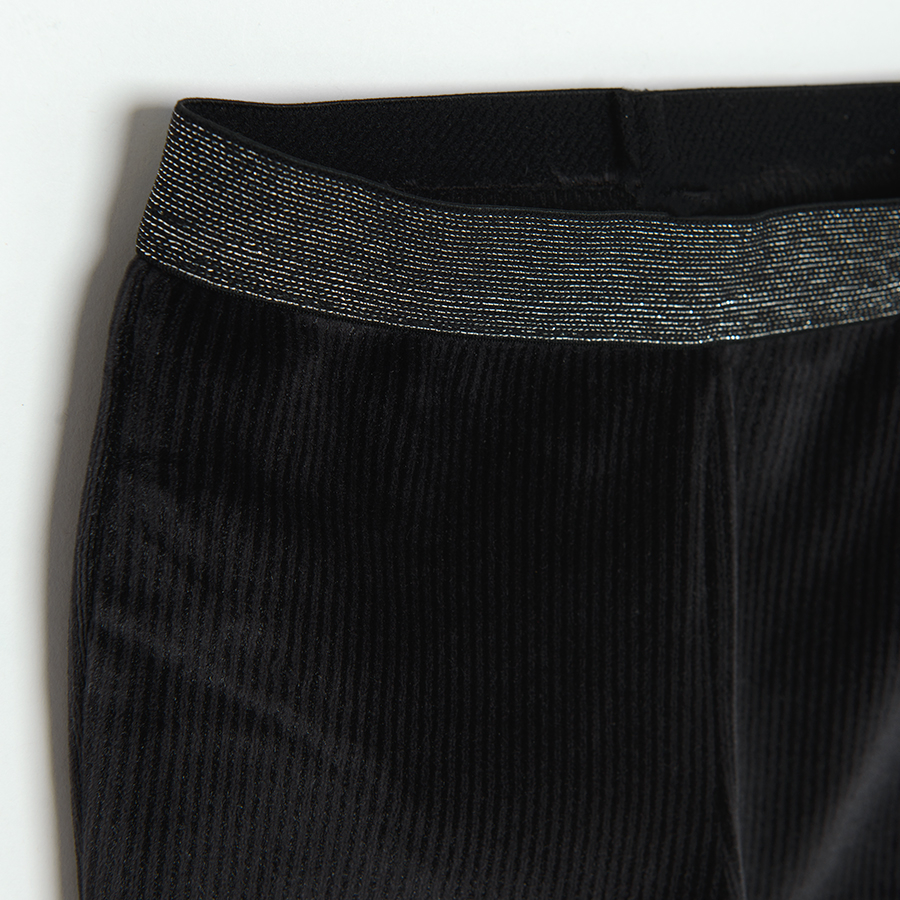 Black wide leg jeggings with silver elastic belt