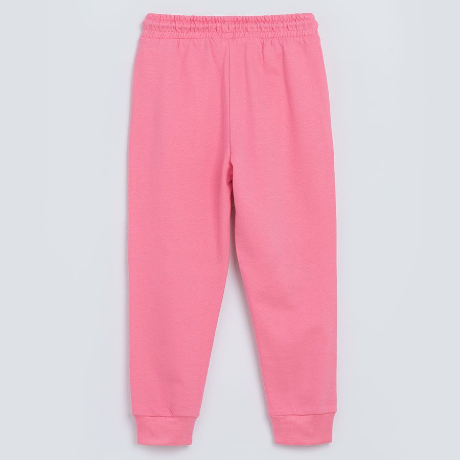 Pink jogging pants with unicorn print on the knees