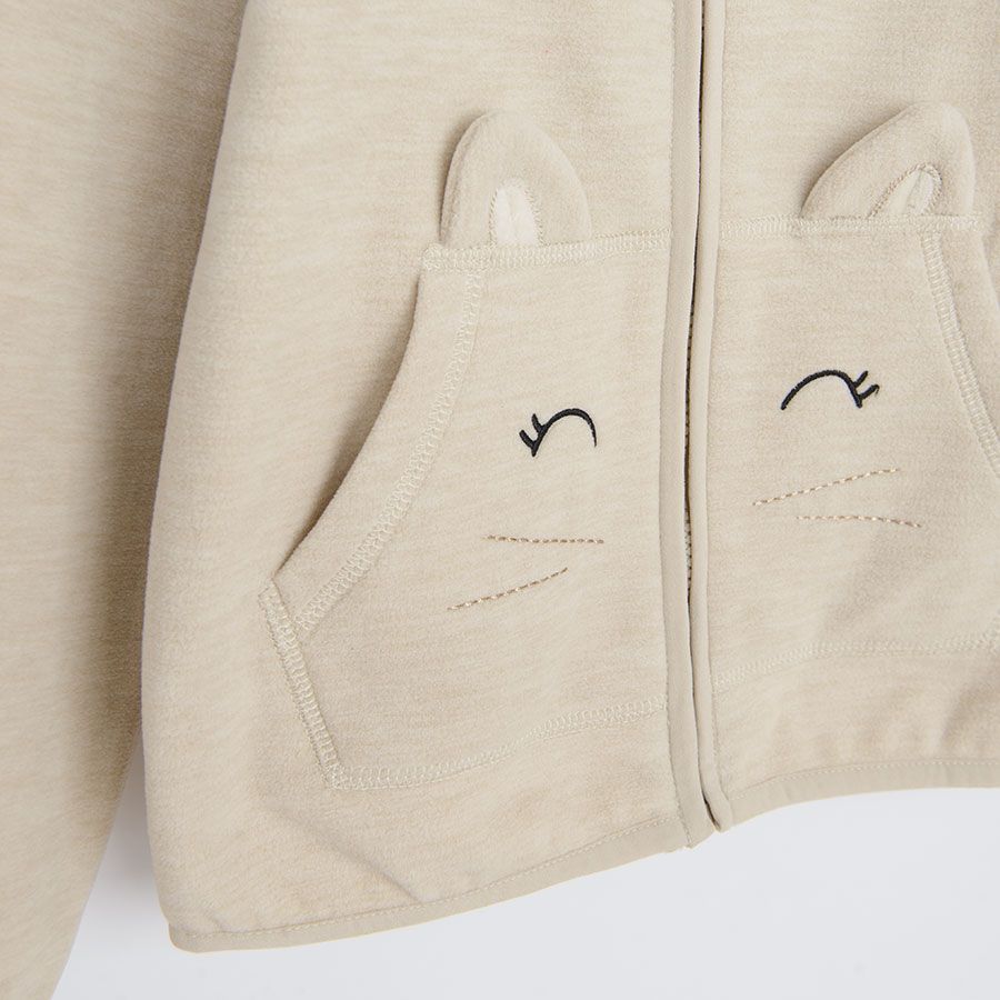 Beige zip through sweatshirt with high neck and kitten print on the pockets