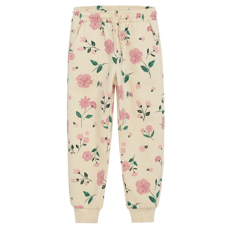 Ecru jogging pants with flowers print