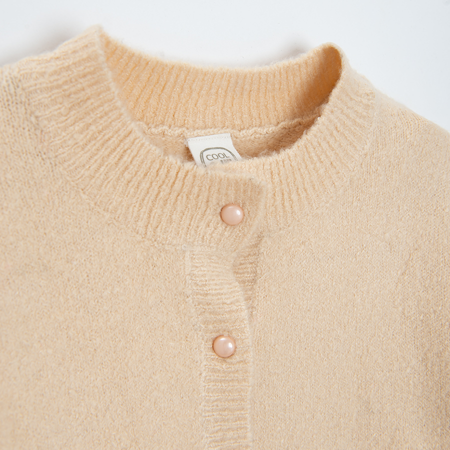 White cardigan with raindeer print on the side pockets