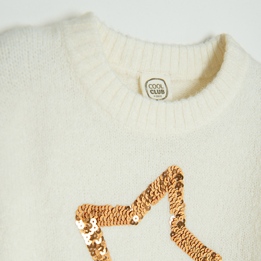 White sweater with gold star pint