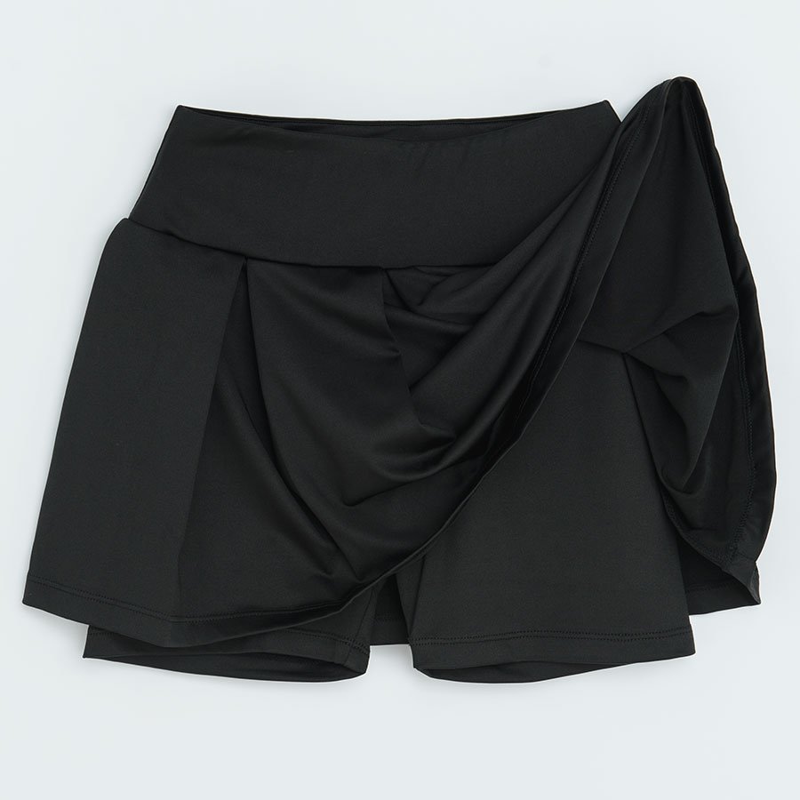 Black shorts with pleated skirt on top