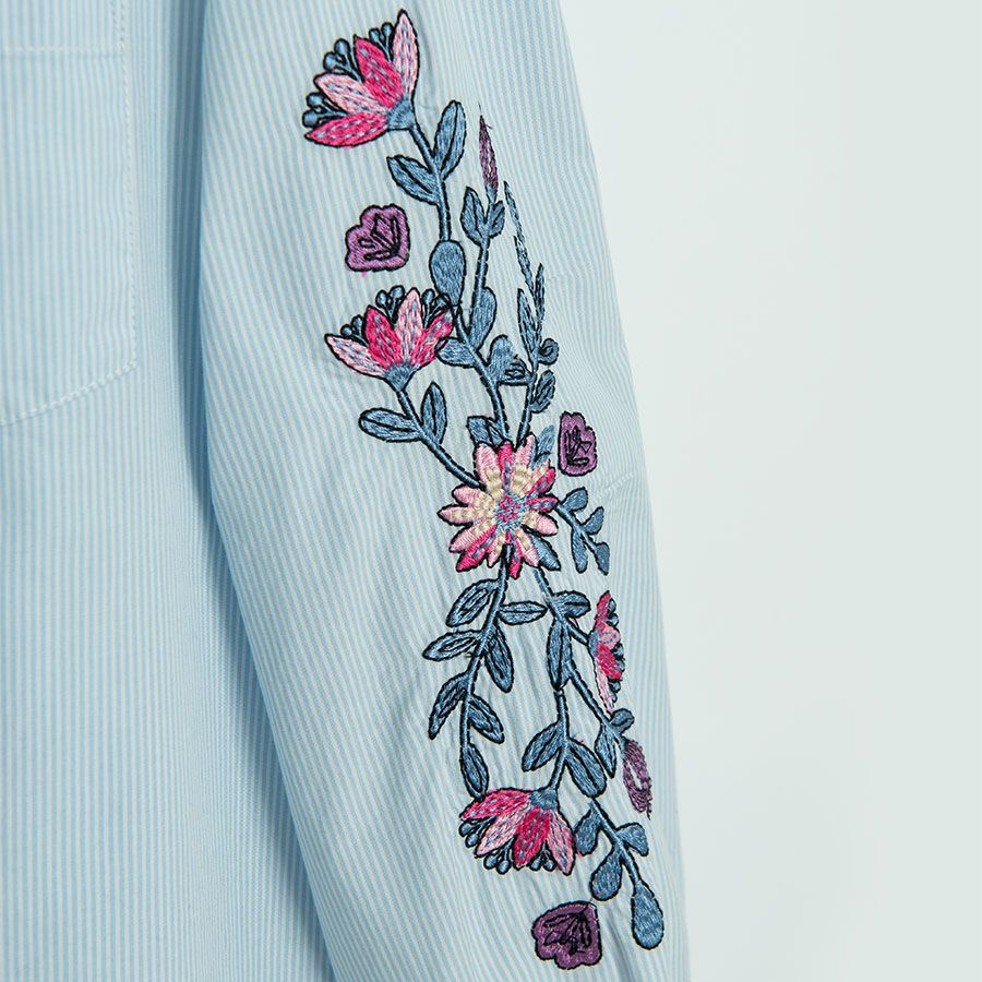 Light blue shirt with long floral embroidered sleeves